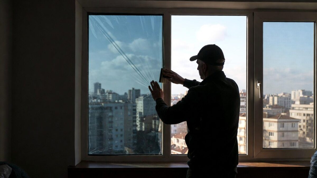 person-installing-window-film-image