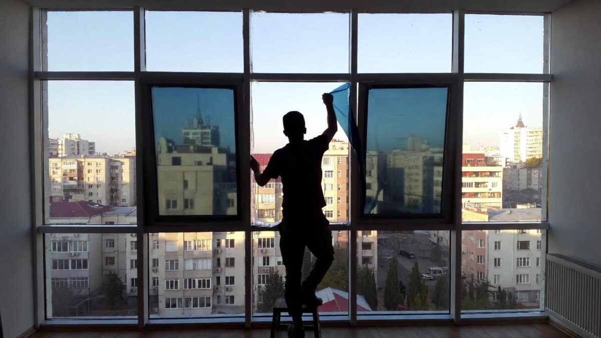 person-installing-window-film-image