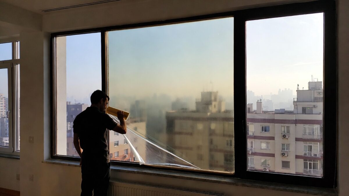 person-installing-window-film-image