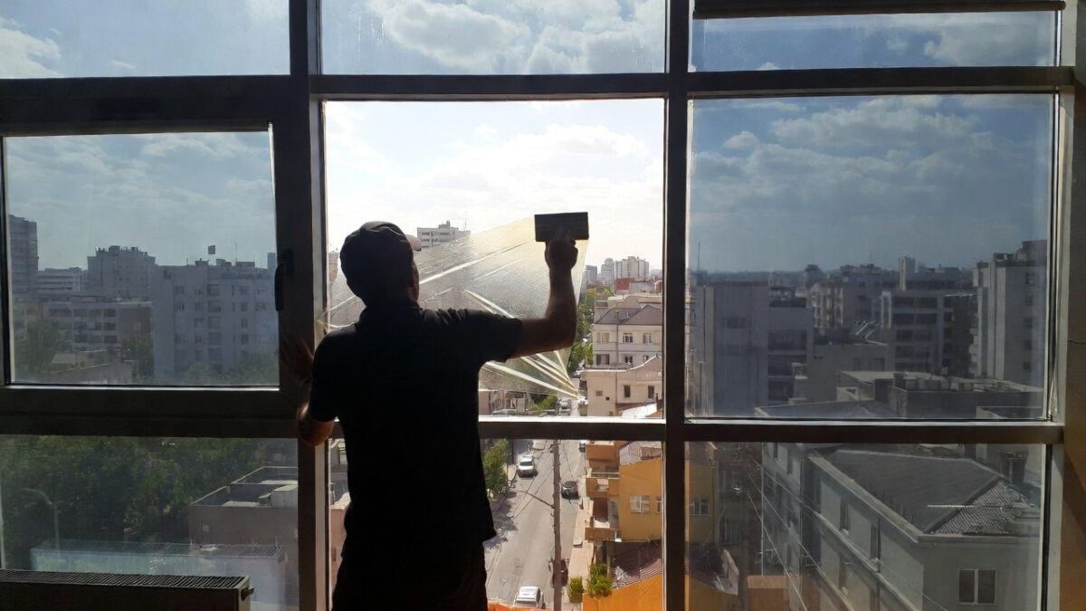person-installing-commercial-window-film-image